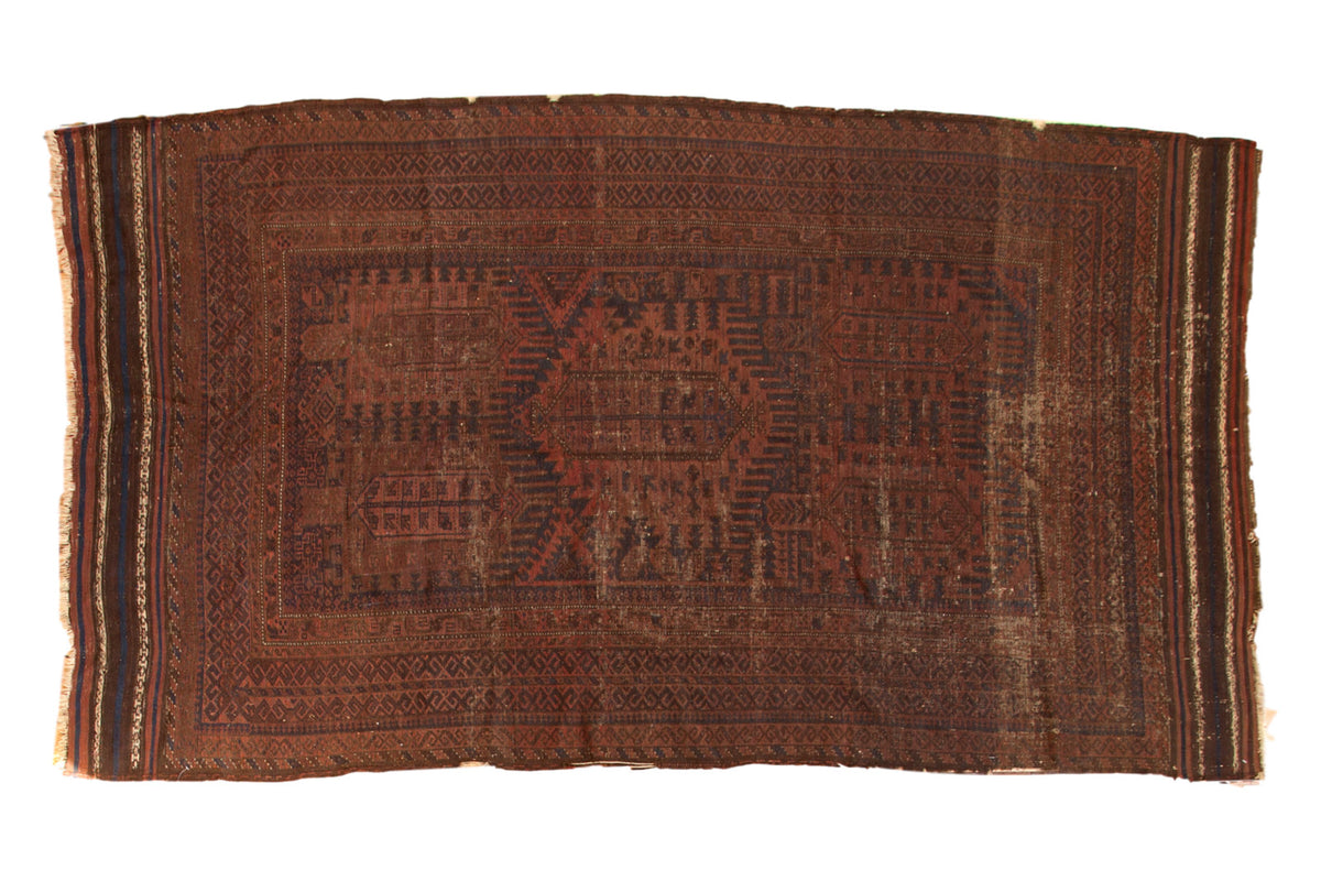 Vintage hand-knotted Belouch carpet with faded madder red, navy geometric tree of life motifs.
