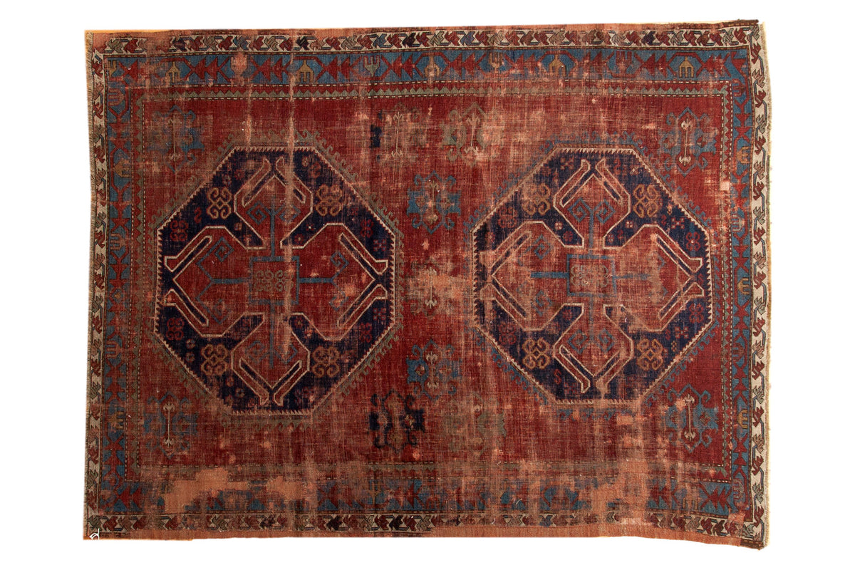 Vintage Caucasian rug, navy blue double medallions, geometric red and sky blue patterns.