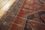 Vintage Caucasian rug's sky blue geometric border with red patterns and brick red field.