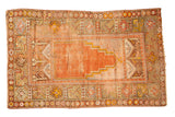 Antique Turkish Oushak prayer rug, stepped mihrab design, orange, saffron, terra cotta colors.