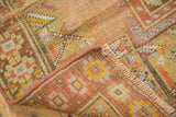 Folded antique Oushak rug showing hand-knotted pile, secure side, and woven foundation.
