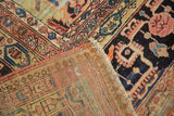 Antique Persian Farahan rug's hand-knotted foundation and ornate navy, blush, sky blue motifs.