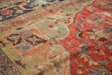 Antique Farahan carpet detail: ornate scalloped design, time-softened blush, wine red, and oxidized green.