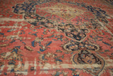 Antique Farahan detail: blush rose field, rich navy curvilinear motifs, and storied wear.