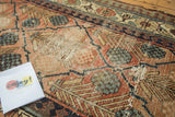 Antique Hamadan runner detail: unique checkered lily pattern, cinnabar field, visible foundation.