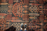 Antique Kurdish Bijar carpet's dense forest foliage design in madder root red and dark navy.