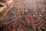 Antique Kurdish Bijar carpet's dense geometric trees and forest foliage in madder red and navy.