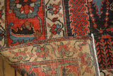 Antique Kurdish Bijar carpet's madder red, teal foliage and geometric reverse pattern.