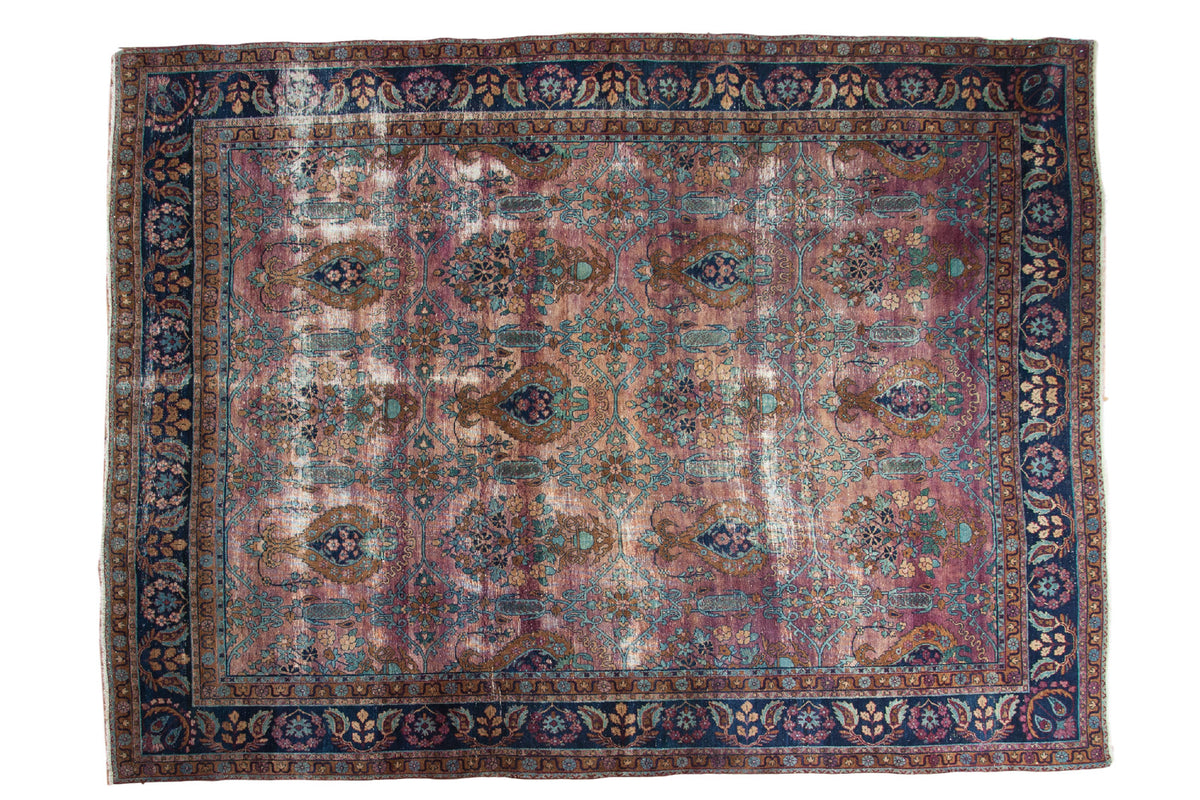 Distressed vintage Yezd carpet, rare plum field with tree of life and vase motifs.