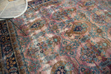 Distressed vintage Yezd rug, purple plum field with tree of life and vase motifs.