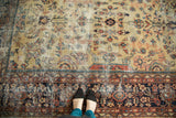 Vintage Mahal carpet showing uneven wear down to knot heads and intricate primitive drawing.