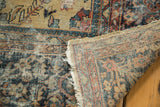 Hand-knotted Mahal carpet, rolled corner showing foundation, tattered edge, and distressed pile.