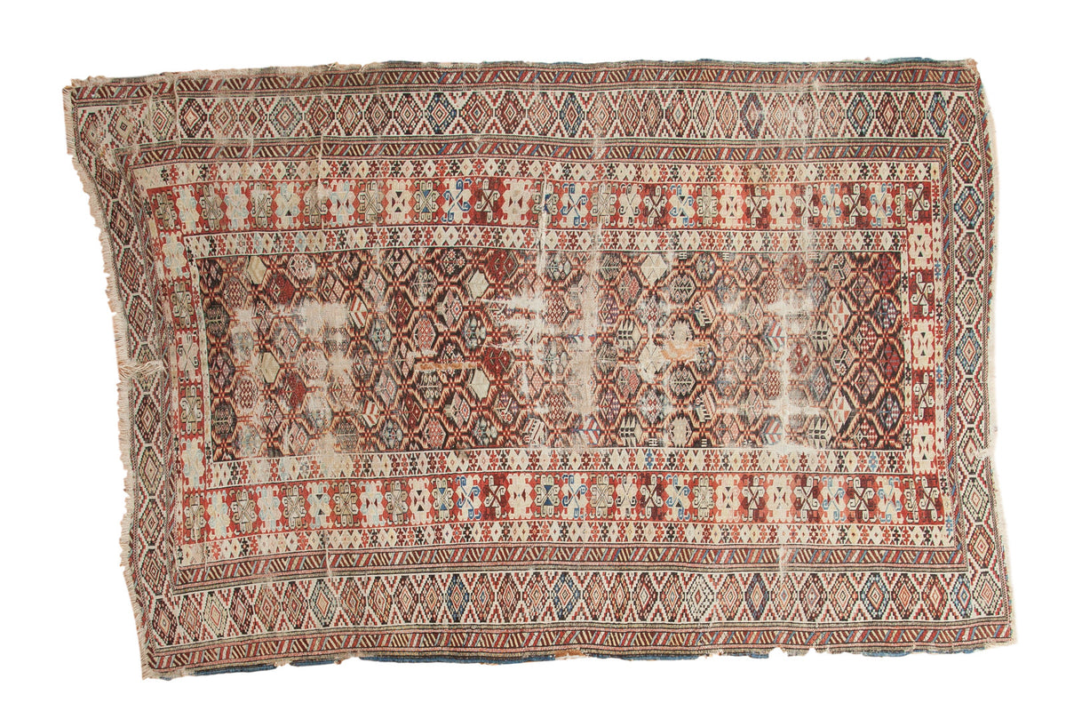 Late 19th century Antique Caucasian carpet, serrated geometric lattice in red, brown, and blue.