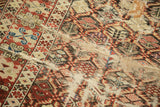 Exposed foundation and significant pile wear on an antique Caucasian tribal rug.
