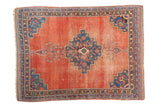 Distressed antique Persian Afshar rug, blush terra cotta field, geometric medallion, 4'5