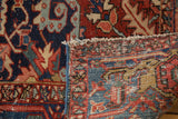 Hand-knotted foundation and geometric vinery pile with rich colors on a Vintage Heriz rug.