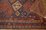 Antique Afshar rug border with stylized birds and geometric patterns in madder red and indigo.