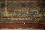 Antique Belouch carpet plain-woven end: large hole, threadbare weave, brown, madder red, navy tones.