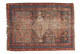 Persian Afshar rug with faded red and navy floral medallion, measuring 4'2