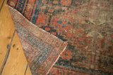 Vintage Afshar rug showing significant threadbare wear, exposed foundation, and intricate pattern.