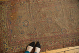 Antique camel hair runner, faded allover pomegranate and plant motifs, worn to foundation, tattered.