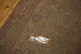 Worn foundation of antique camel hair rug with faded patterns.