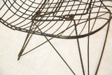 Intricate wire construction of the rare cat's cradle base on an Eames LKR chair.