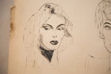 A woman's glamorous charcoal portrait on textured paper with a visibly torn edge.