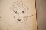 Detail of a tear and aged paper on the vintage 1930s charcoal glamour drawing.
