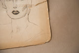 Torn paper edge and charcoal-drawn lips on a vintage 1930s glamour sketch.