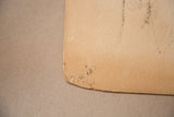 Aged paper texture and smudged charcoal marks on the corner of the 1930s glamour sketch.