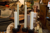 Tall celadon square taper candles and ivory beeswax candles in black holders.
