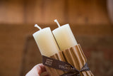 Cream beeswax column taper candles, showing wicks and Greentree Home brand ribbon packaging.
