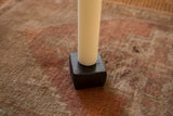 Made in NY Cast Iron Candle Holder with matte finish, holding a white taper.