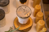 Rustic zinc lid with 'Ball Jelly Glass' embossing on the vintage soy candle.