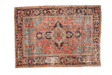 Vintage hand-knotted Heriz carpet with rectilinear medallion in blush, sea foam green, and indigo blue.