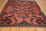 Faded cranberry blush Lilihan rug field with blossoming floral vinery and narrow border.