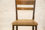 Vintage Toledo Kid's Chair backrest and seat, aged brown wood and dark metal.