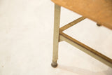 Light green metal leg and worn base of the vintage kid's chair.