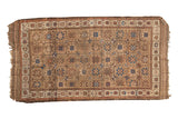 Antique Belouch rug runner, geometric repeating starburst gul and pinwheel motifs in camel, blue, red.