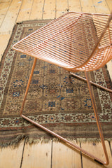Antique Belouch runner features starburst gul motifs, sky blue, madder red, and tattered end.
