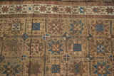 Time-softened camel, sky blue, and madder red in geometric gul and pinwheel motifs.