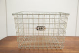 Numbered tag 2640 on the front grid of a vintage wire basket.