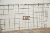 Mid century vintage wire basket grid detail with original numbered Kaspar Wireworks tag.