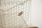 Mid Century vintage grey wire basket detail with Kaspar Wire Works numbered tag.