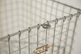 Mid Century industrial gray wire basket top rim with clasp and numbered tag.