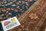 Antique Farahan Sarouk rug: ornate terra cotta border with blush and ivory floral motifs.