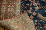 Antique Farahan Sarouk rug corner revealing hand-knotted foundation and central seam.