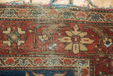 Tattered end of antique Farahan Sarouk rug, revealing woven foundation with terra cotta and ivory.
