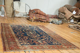 Antique Farahan Sarouk rug, harmonious indigo field, diminutive medallion, terra cotta borders.
